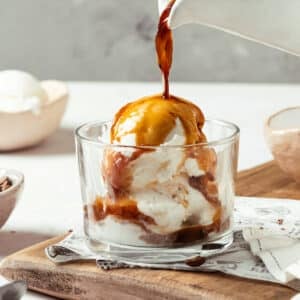 affogato espresso putting together in a glass cup on a wooden board.