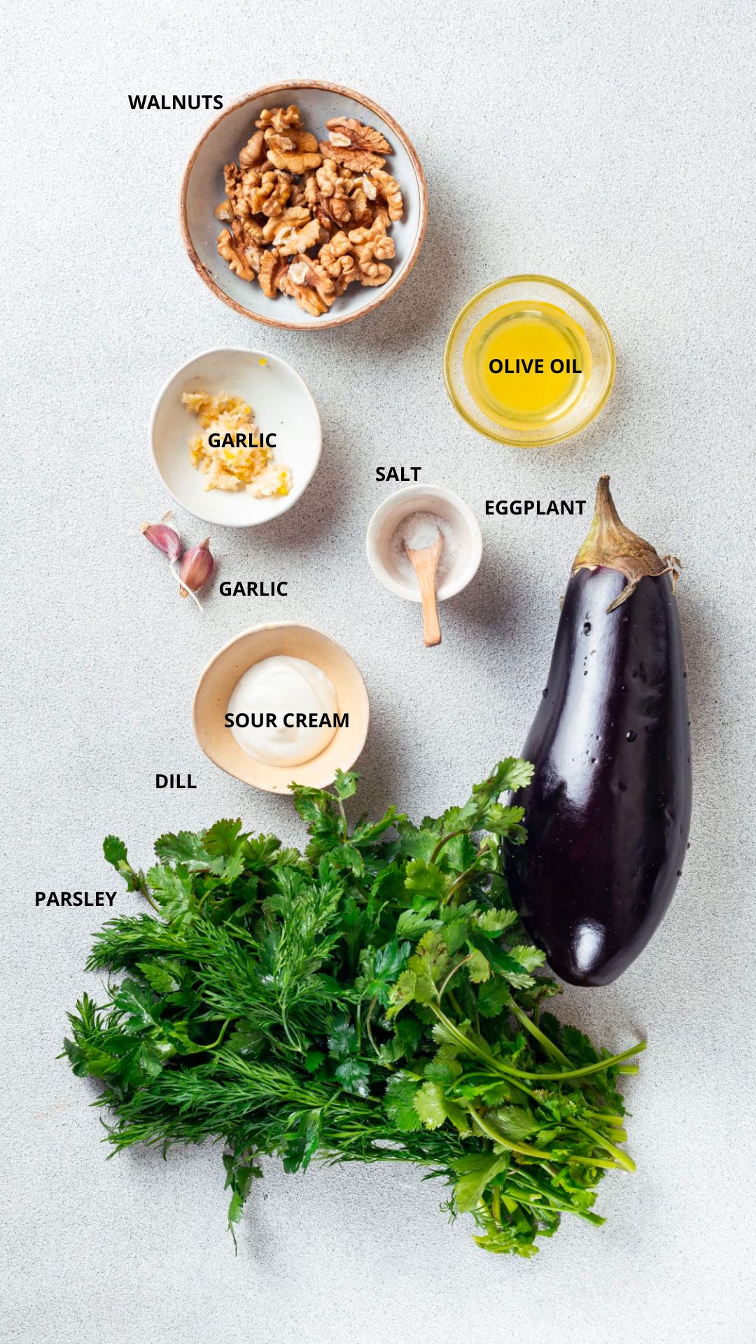 herb and eggplant appetizer ingredients walnuts, olive oil, eggplant, salt, garlic, sour cream, dill, and parsley.