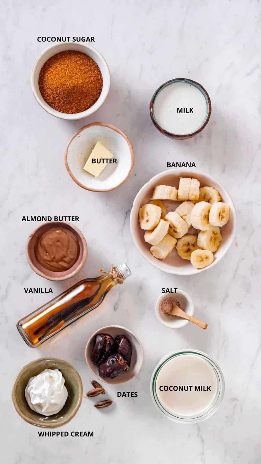 Caramel smoothie recipe ingredients- coconut sugar, milk, butter, banana, almond butter, vanilla, salt, coconut milk, dates, and whipped cream.