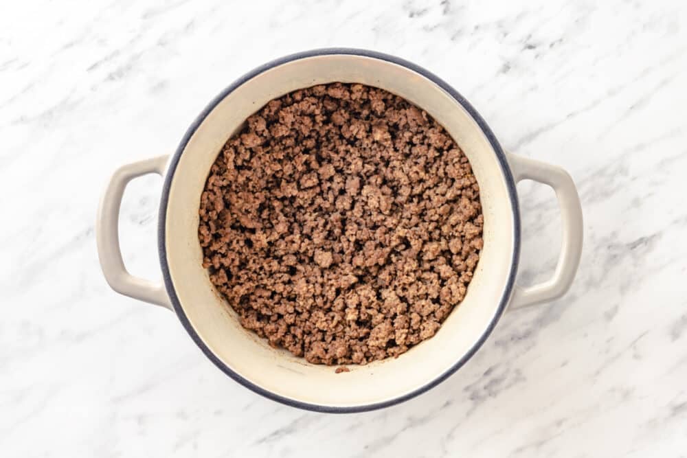 cooked ground beef in a soup pot.