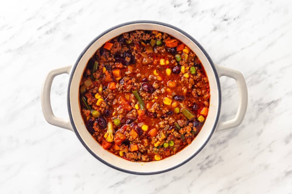 ready chili with beef and vegetables in a soup pot.