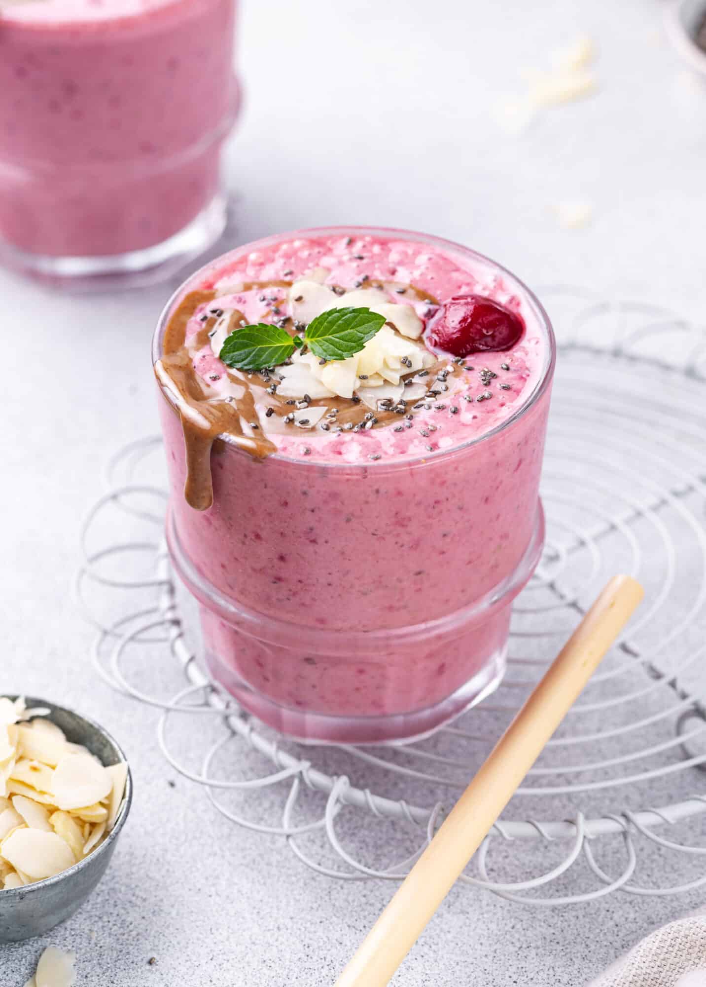 Sweet Cherry Almond Summer Smoothie Cherry smoothie topped with cherries, mint, and almond butter.