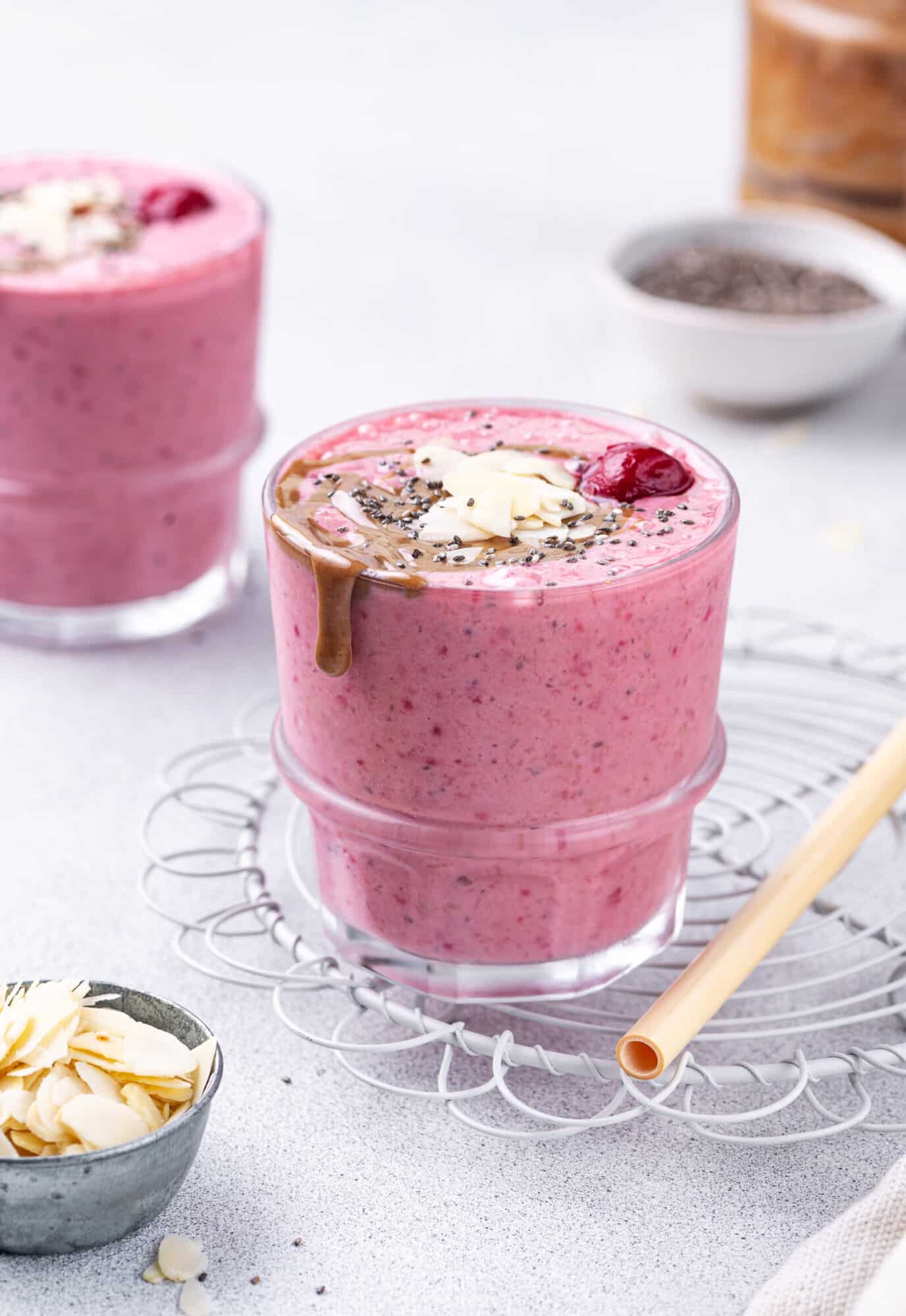 Sweet Cherry Almond Summer Smoothie Smoothie in a glass made with cherries and almond butter.