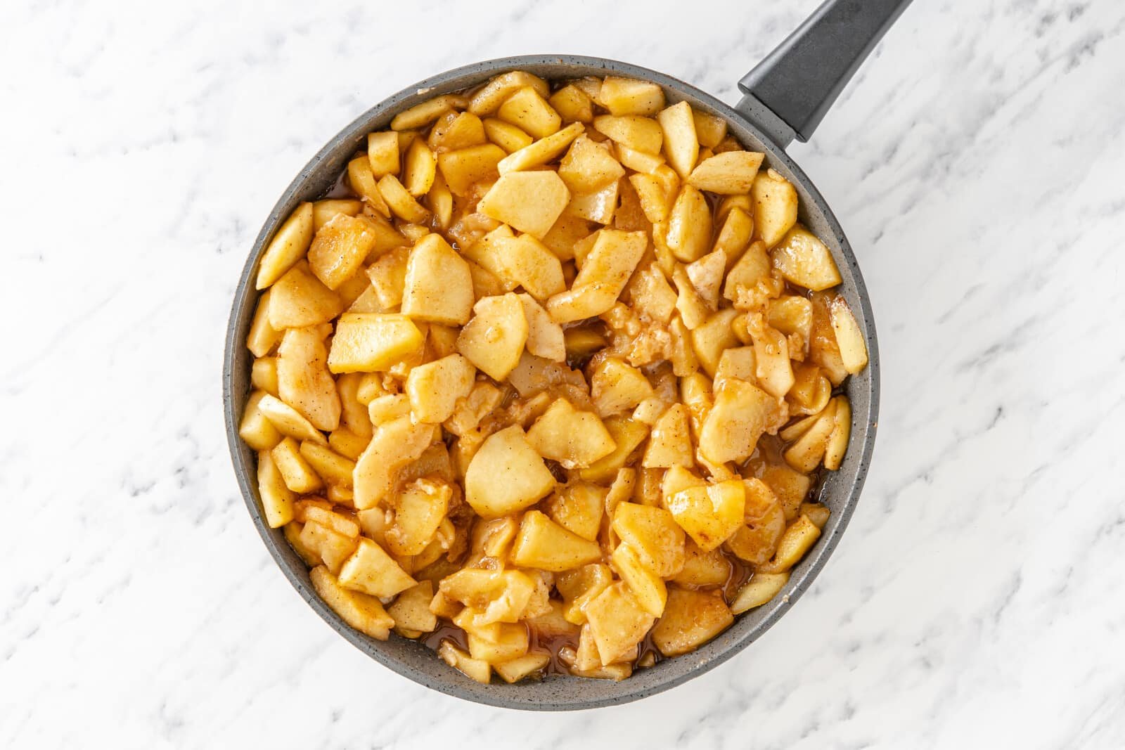 Apple mixture in a skillet.