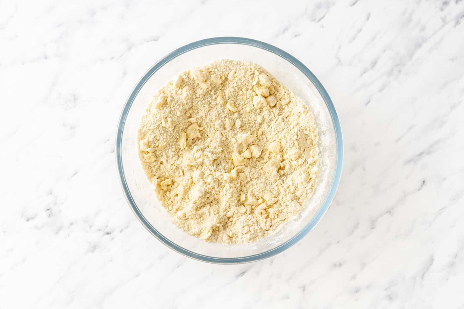 Crust mixture in a glass bowl.