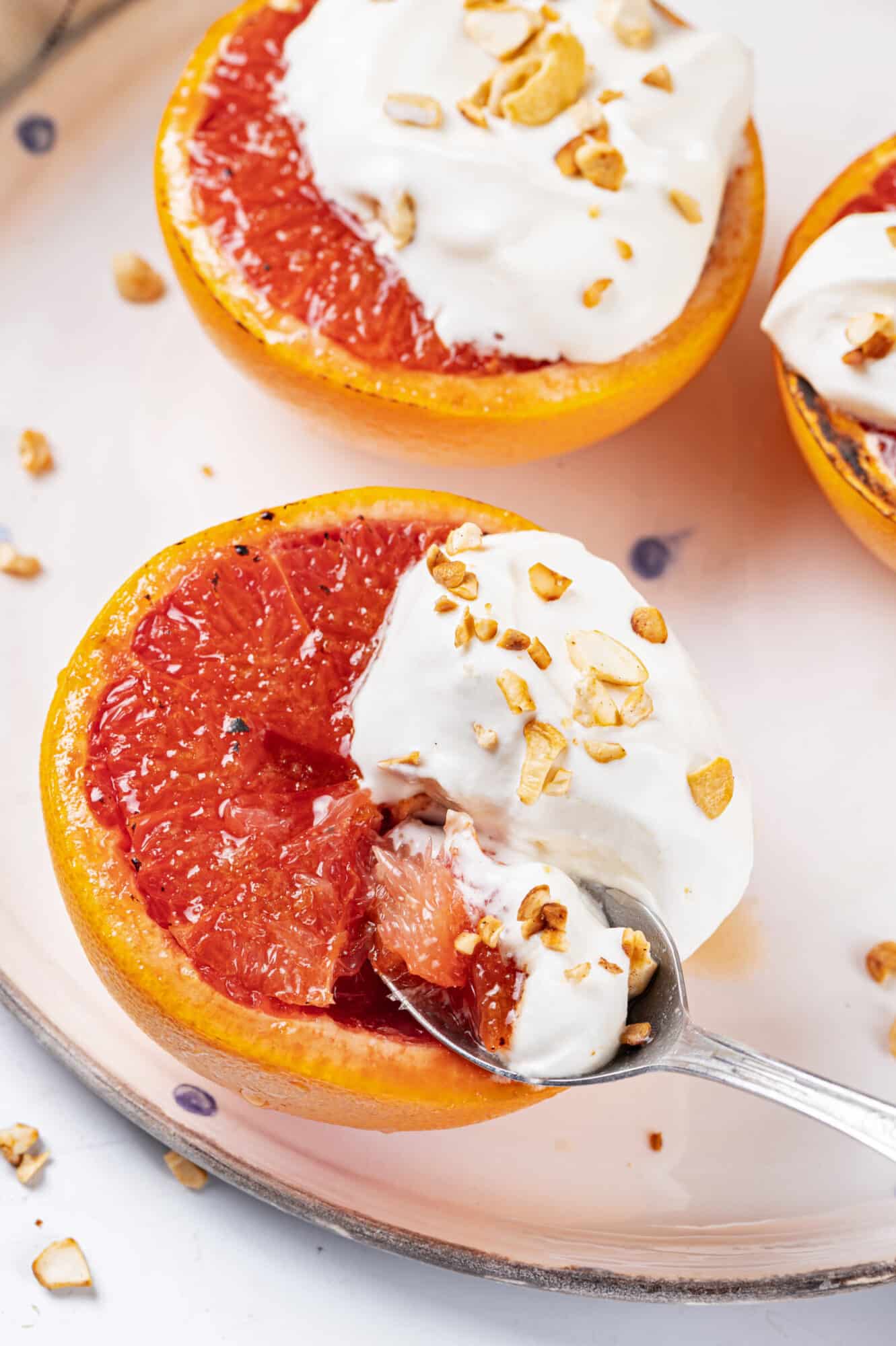 Enjoying grapefruit brûlée with a spoon.
