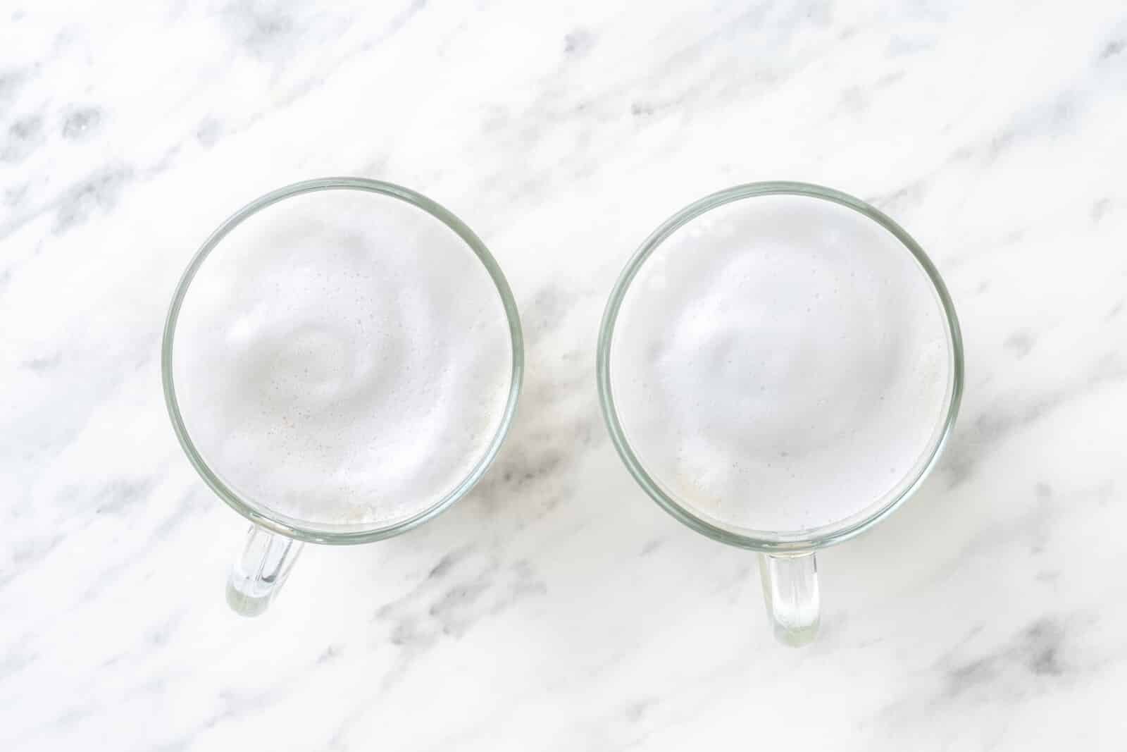 Chai Tea Latte with Warm Spices Frothy milk poured on top in a glass mug.