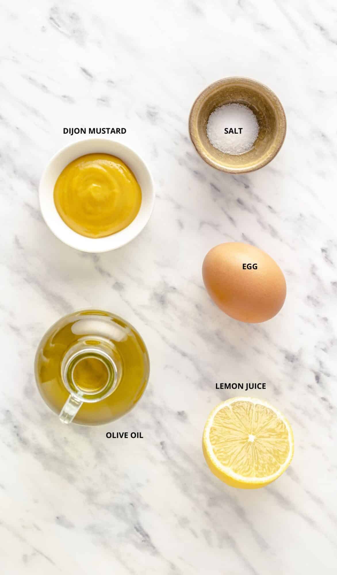 How to Make Mayonnaise From Scratch Mayonnaise ingredients spread with labels.