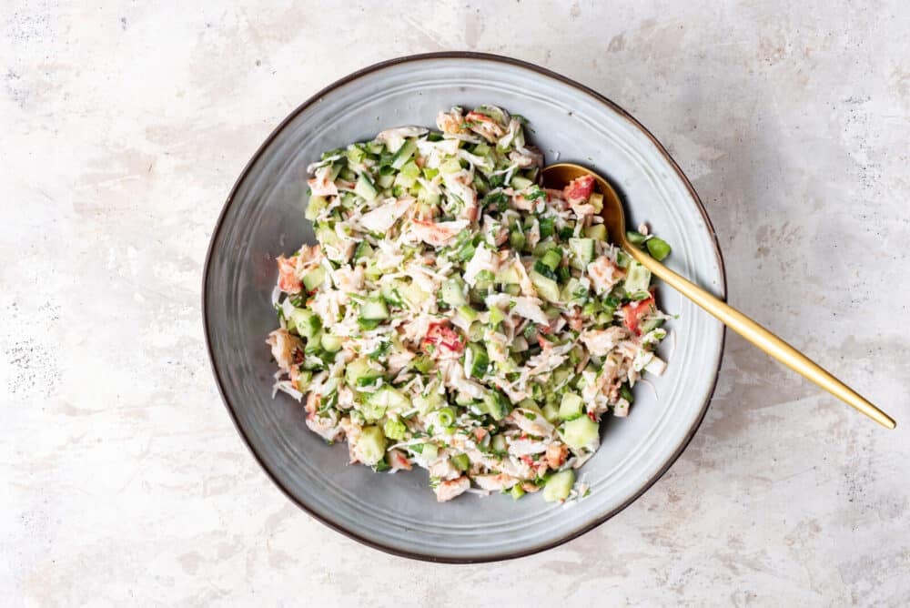 Mixed ingredients in a bowl with mayonnaise.