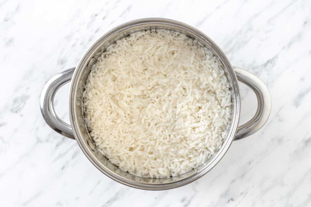 Rice cooked in a silver bowl.