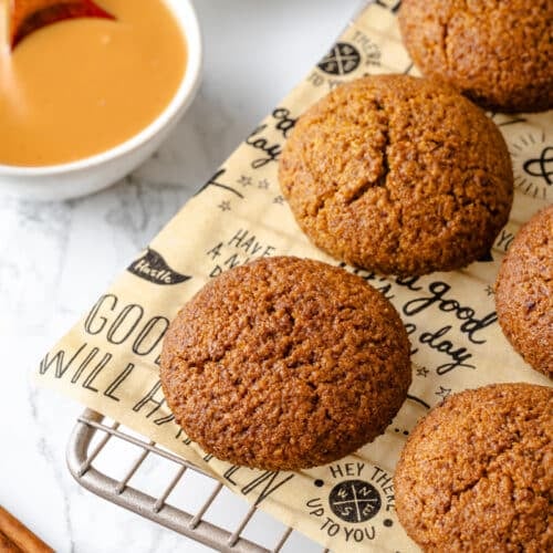 Snickerdoodle almond cookies ready to eat with cinnamon on the side.