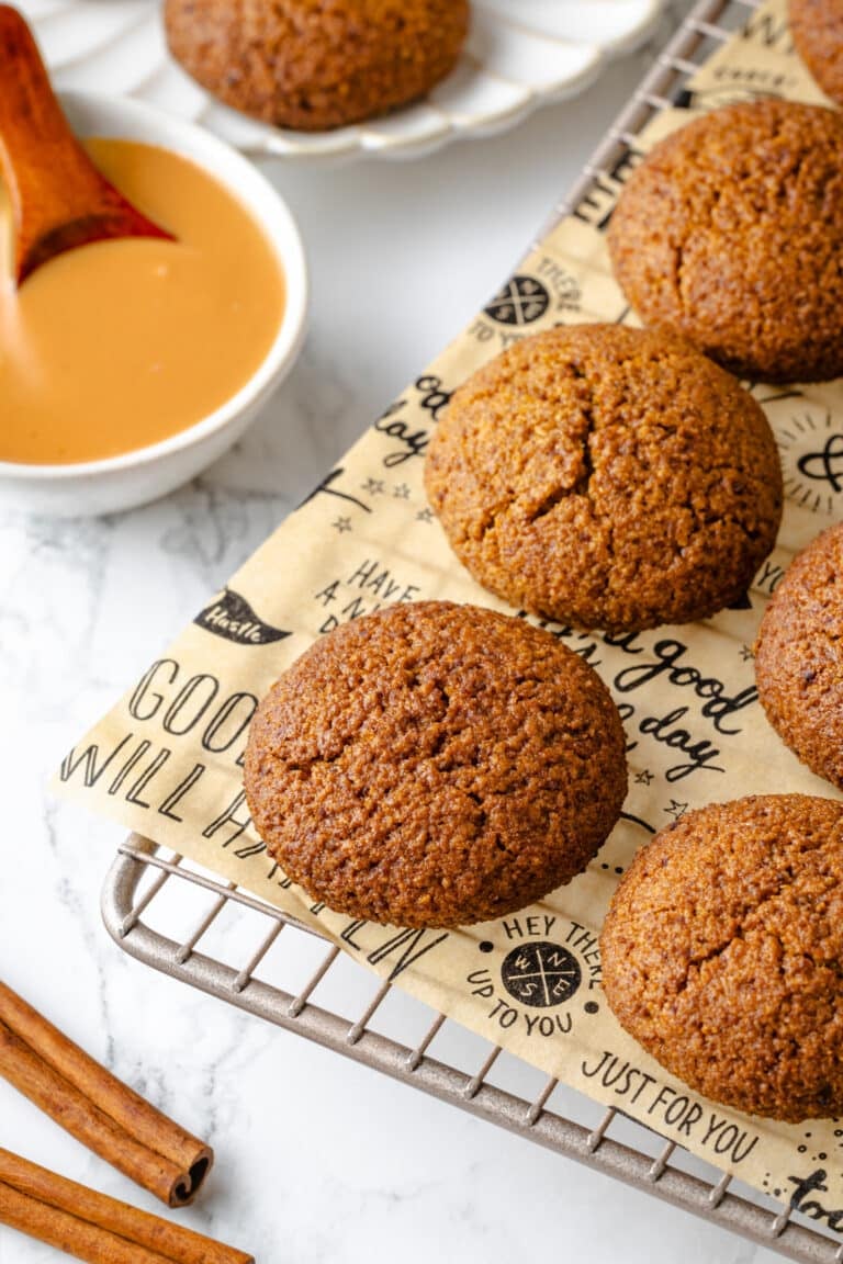Snickerdoodle almond cookies ready to eat with cinnamon on the side.